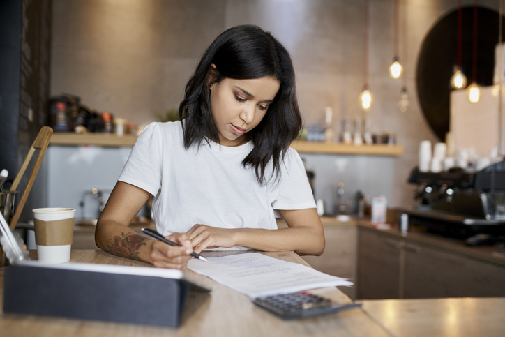 Woman filling out a form.