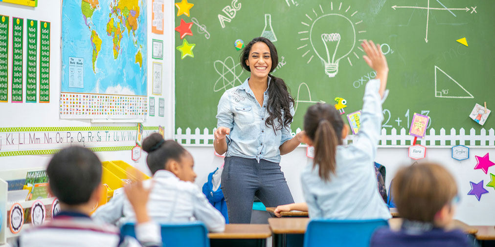 A teacher asking a question to her students
