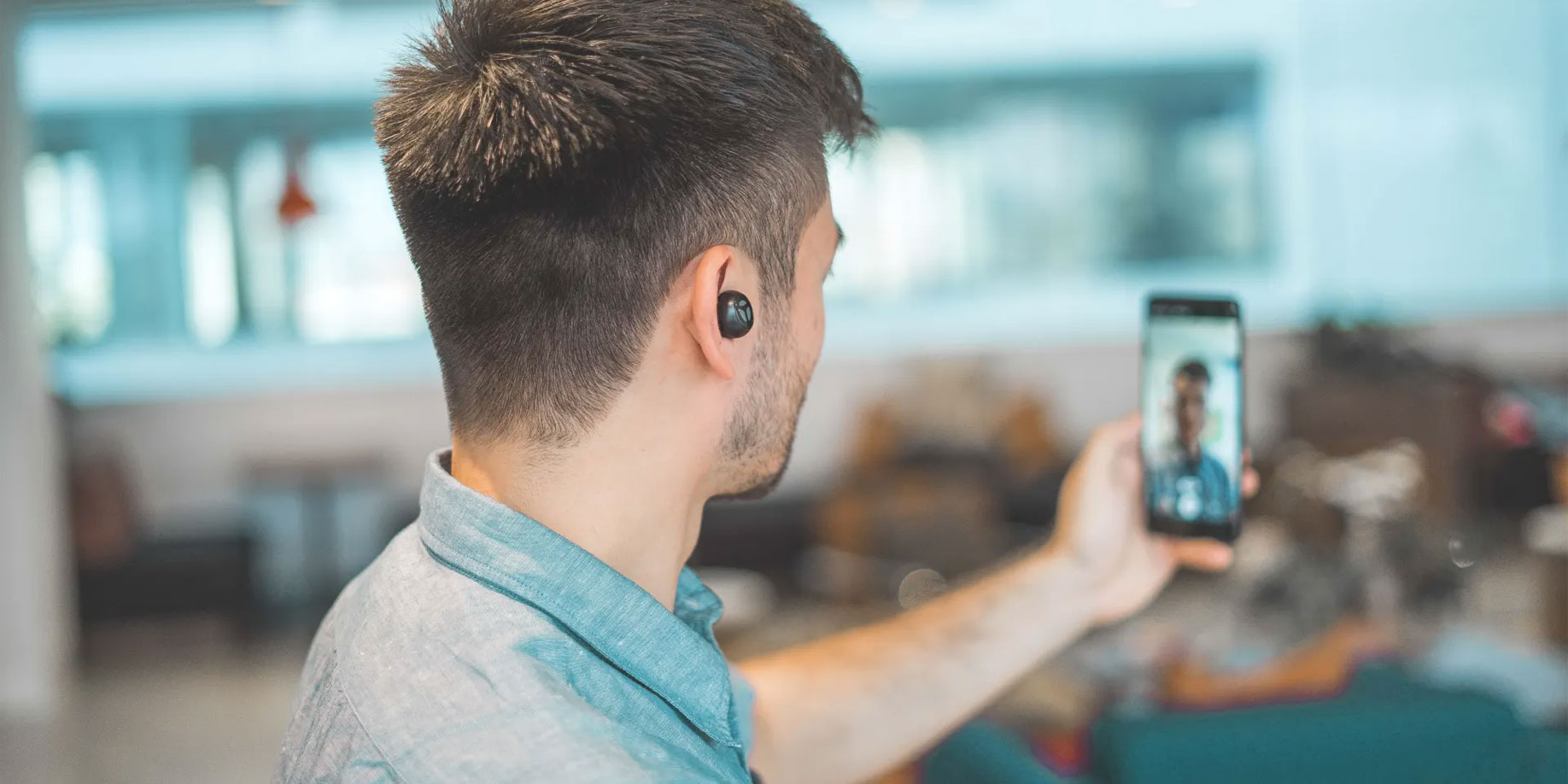 Man recording a video on his phone