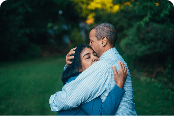 A couple consoling one another