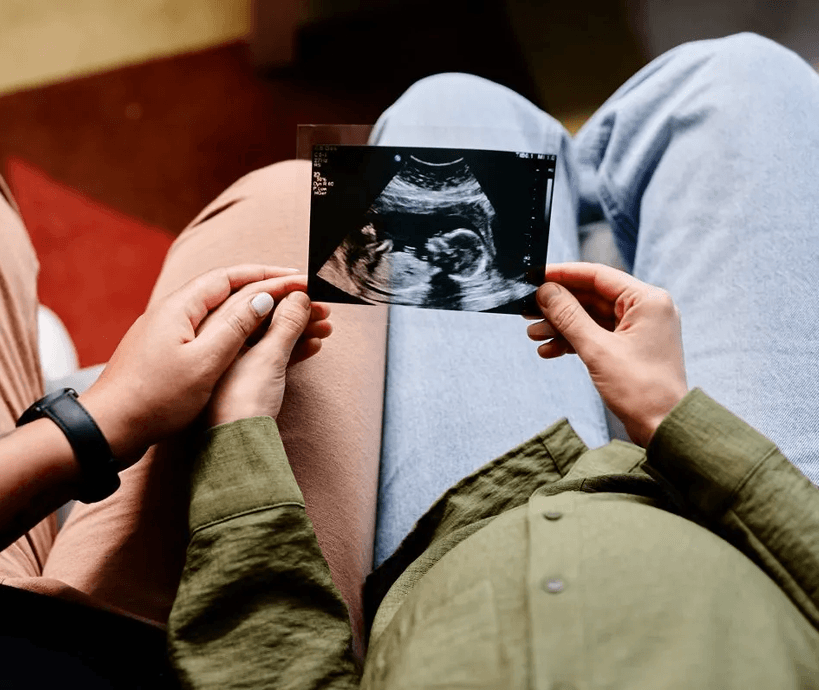 Couple holding an ultrasound
