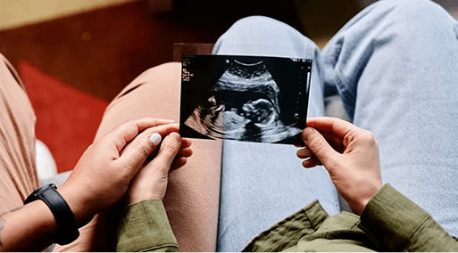 Couple holding an ultrasound