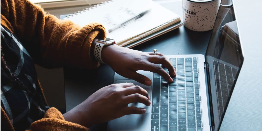 Hands on a laptop